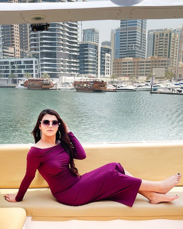 Mehak Shalle in a plum dress on a boat in Dubai Marina